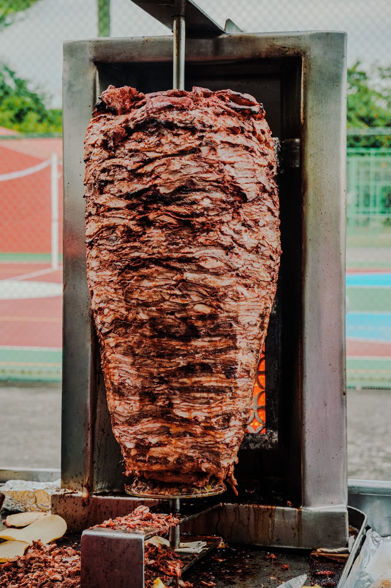 Döner meat on the spit over open flame